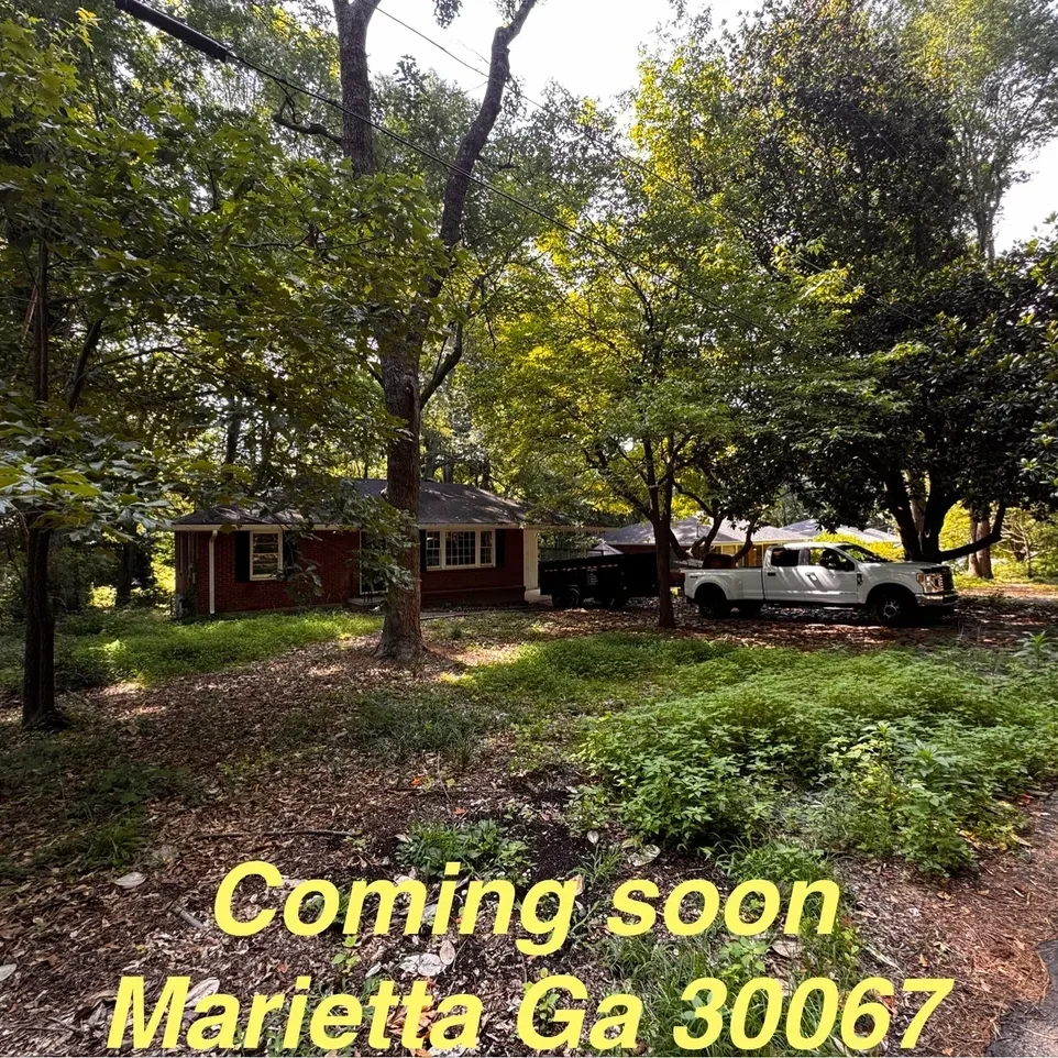 House with "Coming Soon" sign in Marietta.