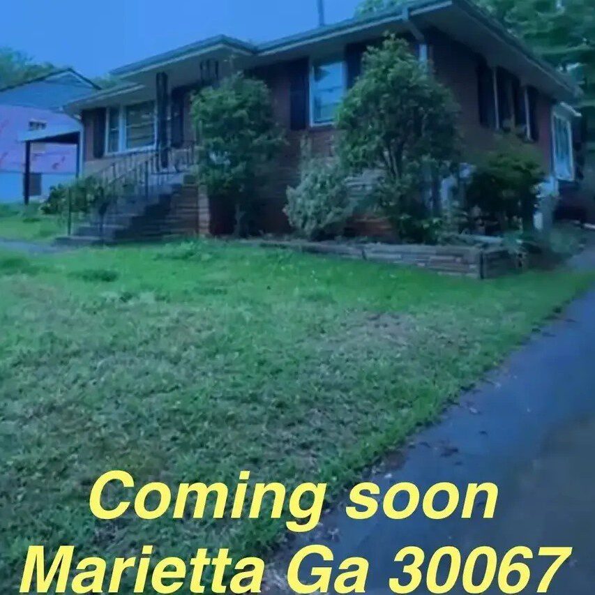 House with "Coming Soon" sign in Marietta.